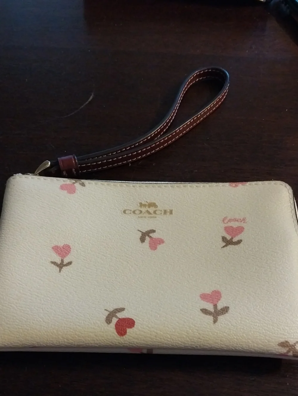 Coach Cream Wristlet with Pink Floral Accents and Brown Strap